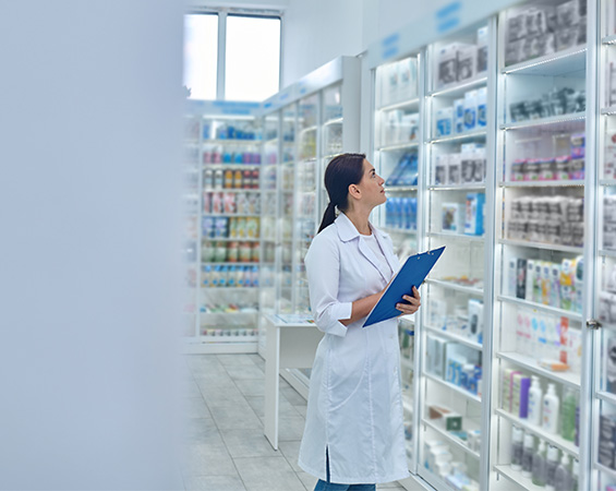 pharmacist-checking-medicines-drugstore